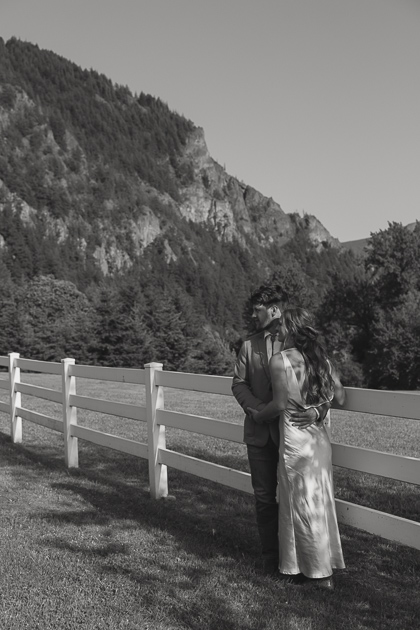 A wedding couple share a quiet moment in the orchard at Wind Mountain Ranch.