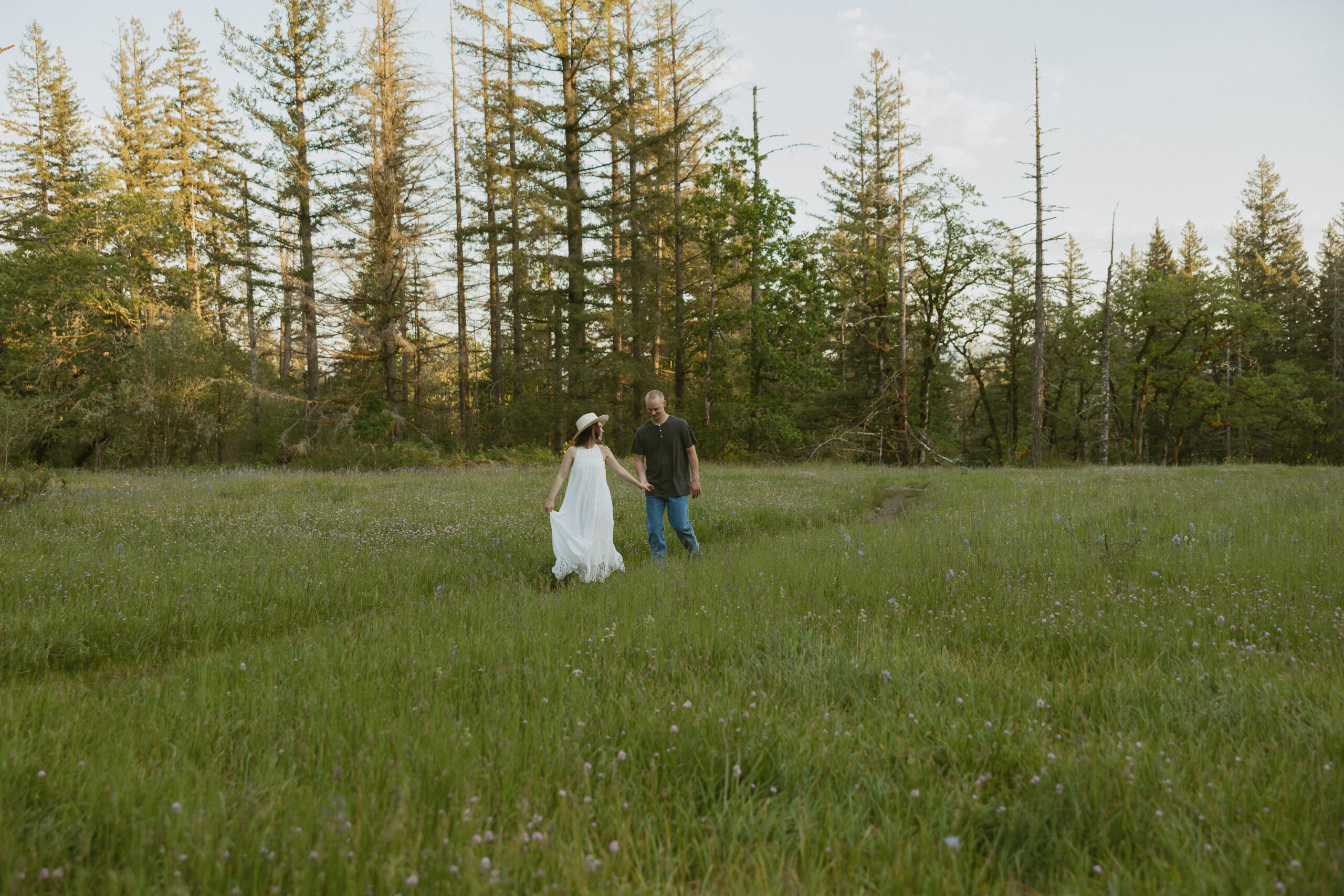 Couples strolling through wildflowers in Washington