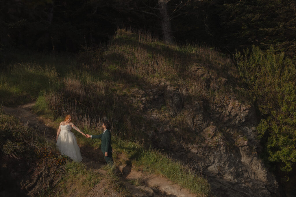 Elopement couple walking the trail at Secret Beach in Brookings, OR