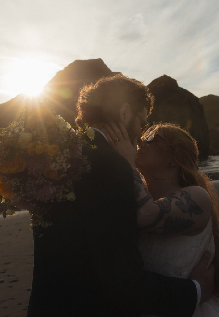 Elopement couple kissing at Amiya's Beach in Brookings, OR