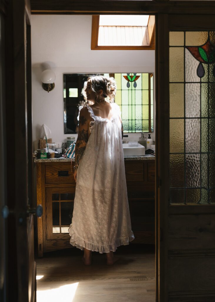 Bride Kelsey getting ready before her intimate wedding celebration at Mount Tom House