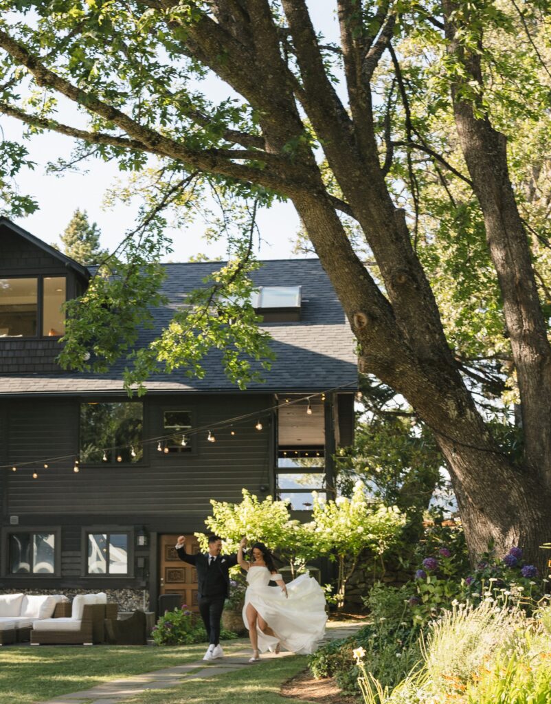 Couple cheering hand-in-hand through the stone terraces at The Griffin House.