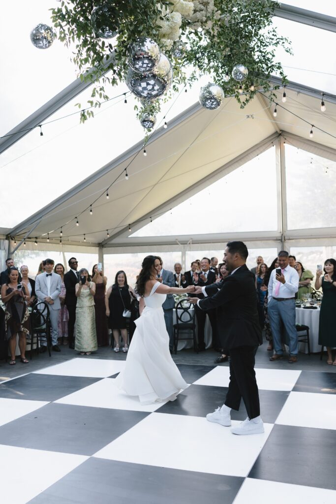 Couple shares a first dance under the Clear Tent.
