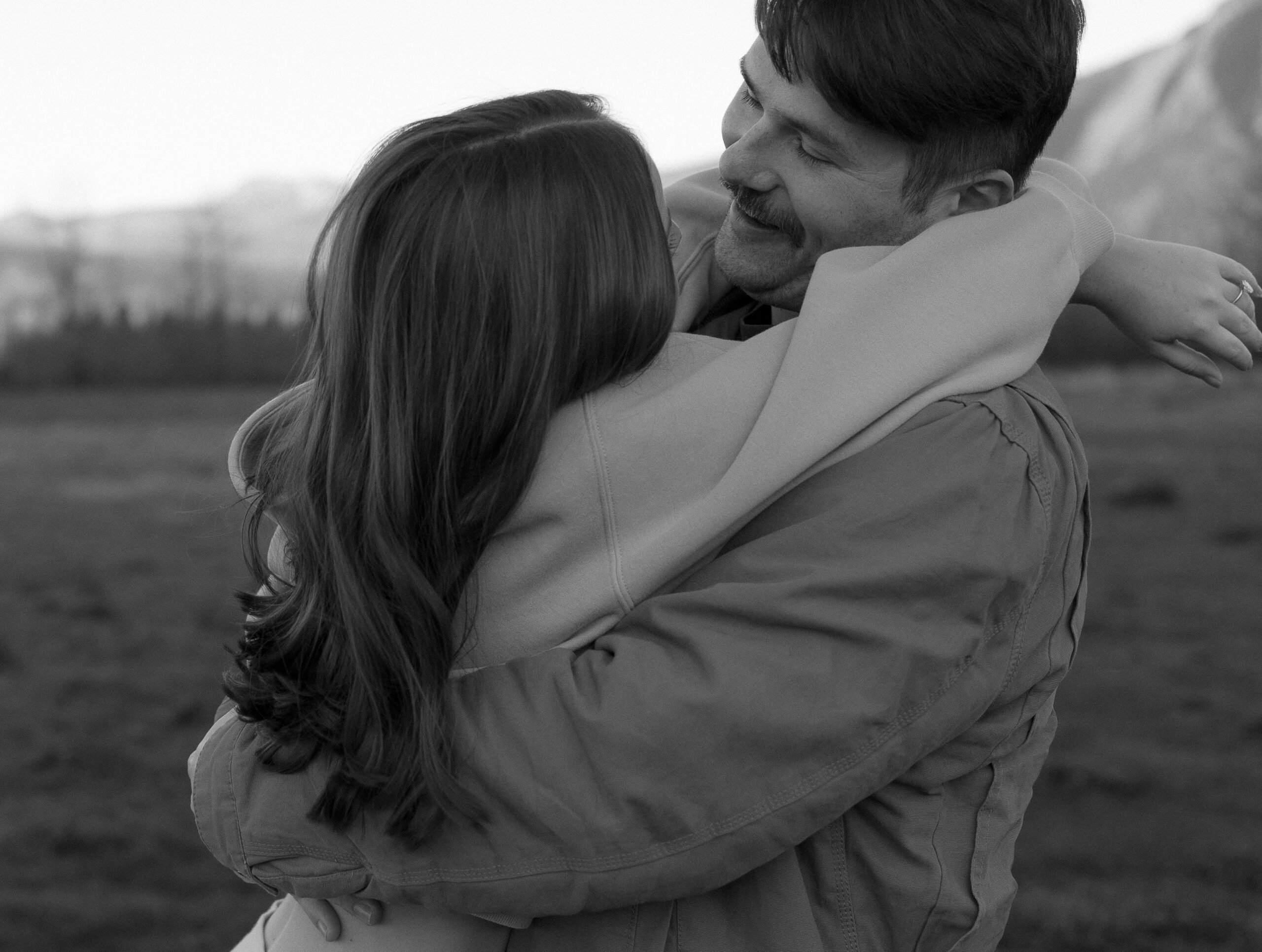 Couple laughing during Elk Fields engagement photos in Snoqualmie