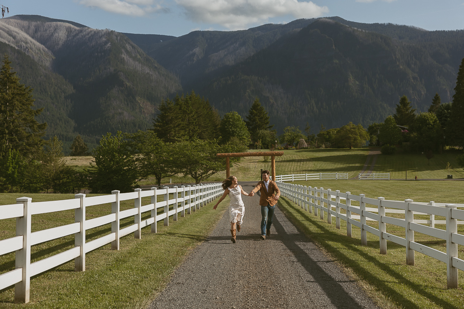 A wedding run down the gravel road at Wind Mountain Ranch.