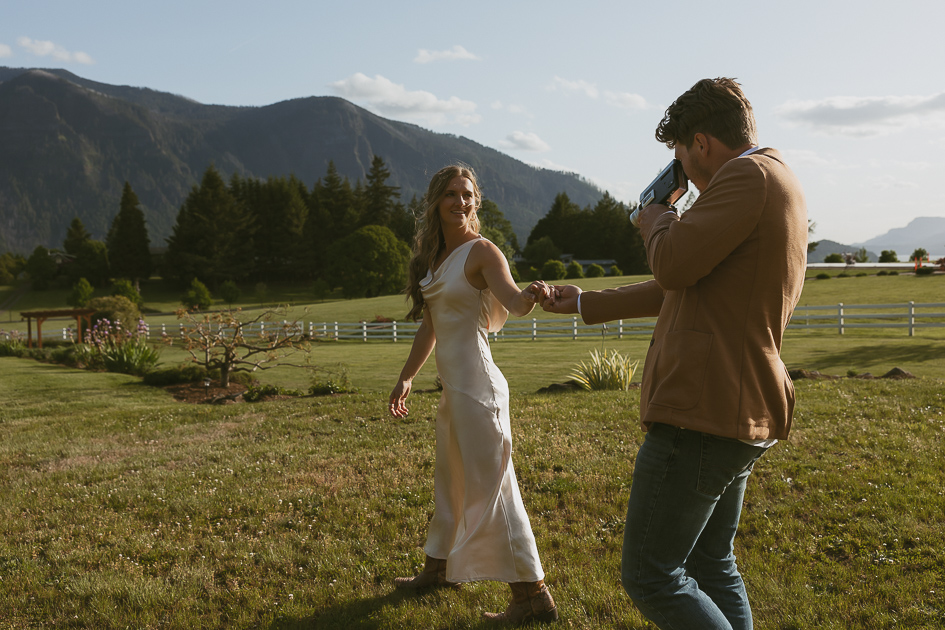 A wedding couple take super 8 video at Wind Mountain Ranch.