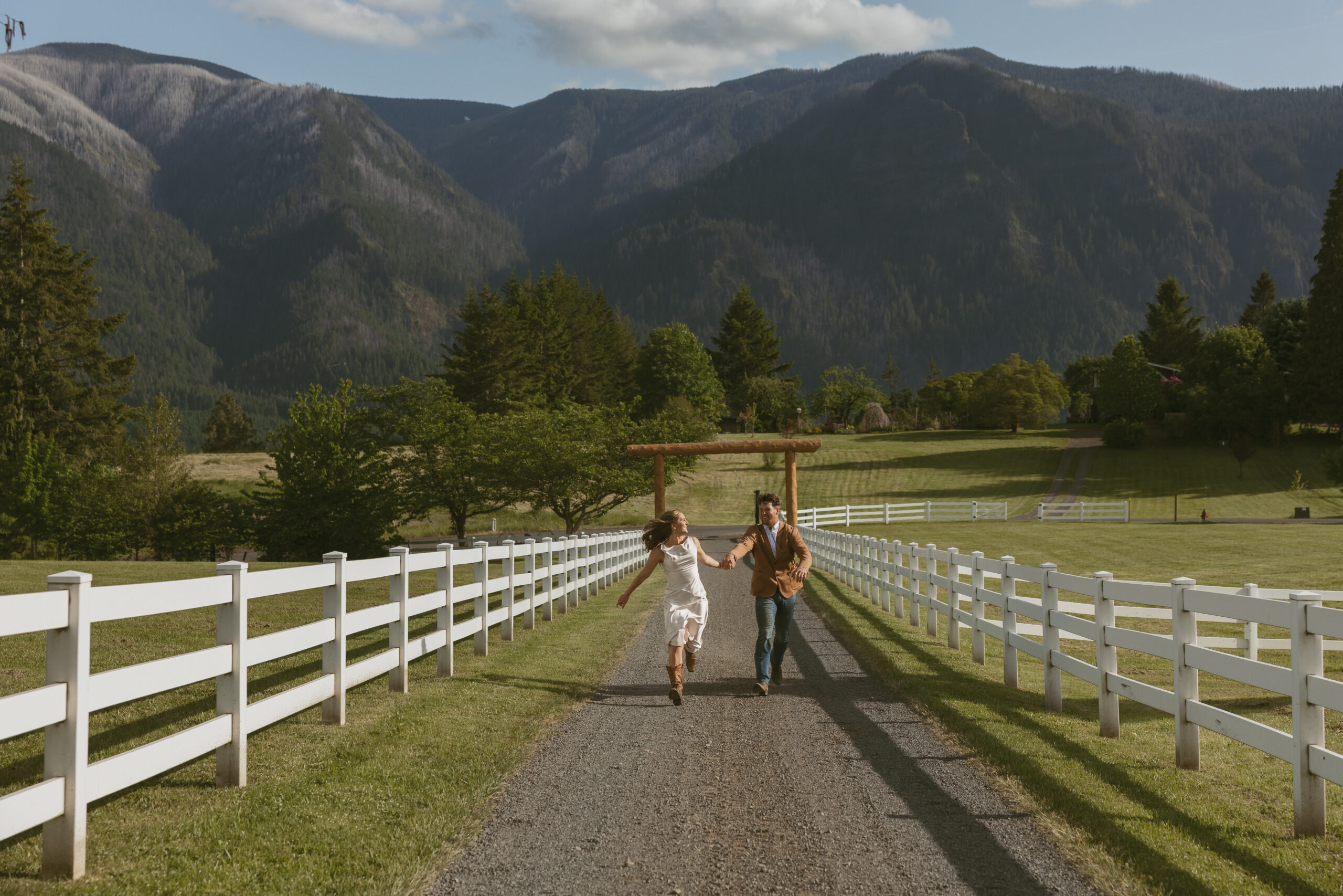 Elopement couple running through the road.