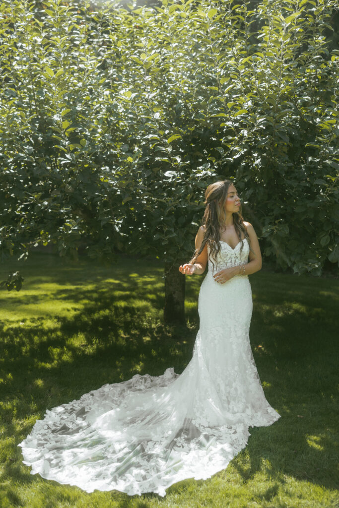 A bride enjoying the garden during her backyard wedding.